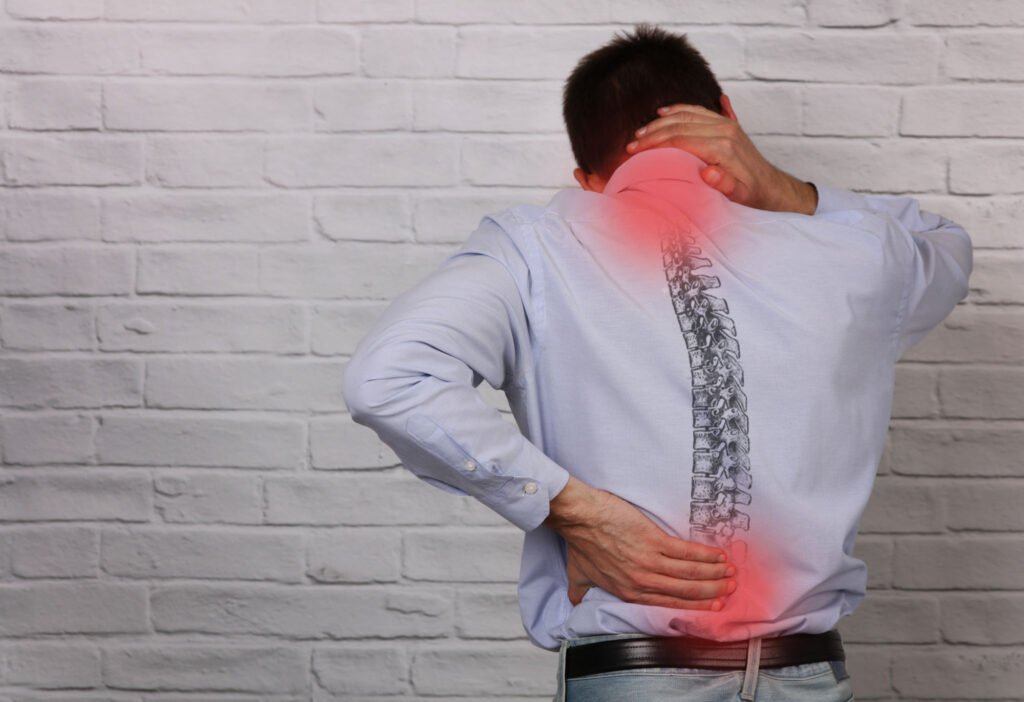 A business man suffering from back pain
