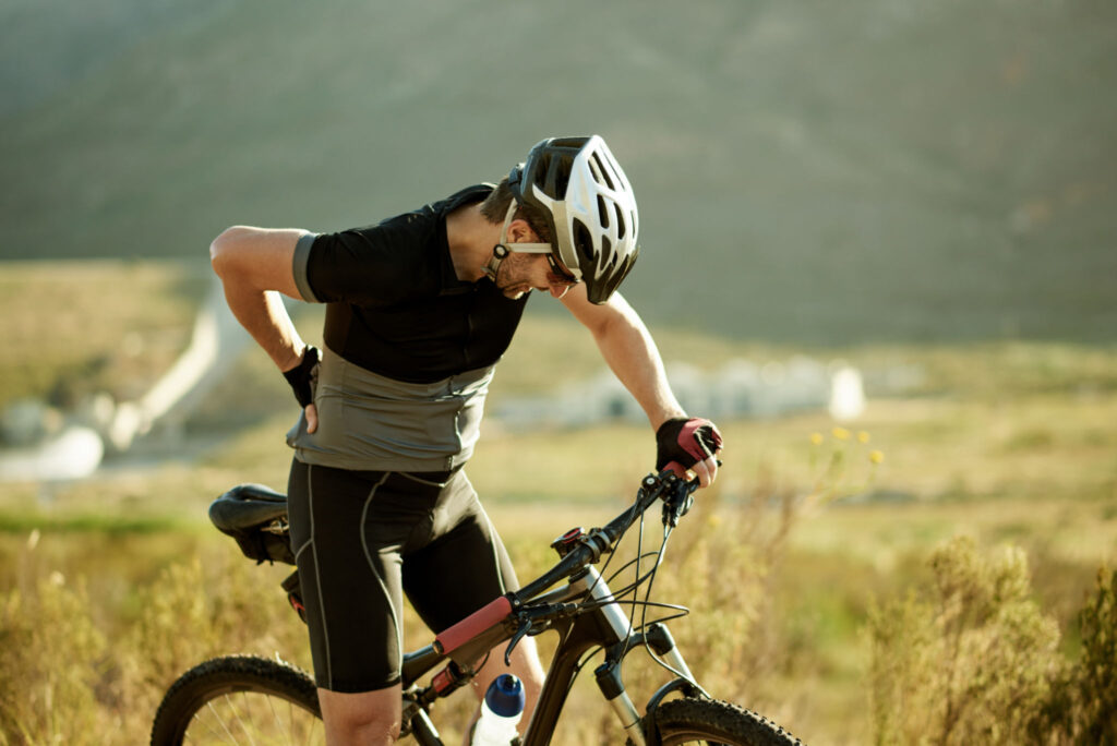 A man riding bicycle showing sign of herniated disc