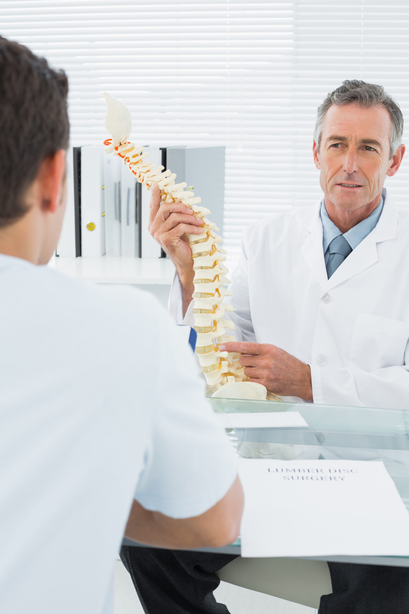 Top spinal orthopedic surgeons in Los Angeles reviewing MRI scans during consultation.