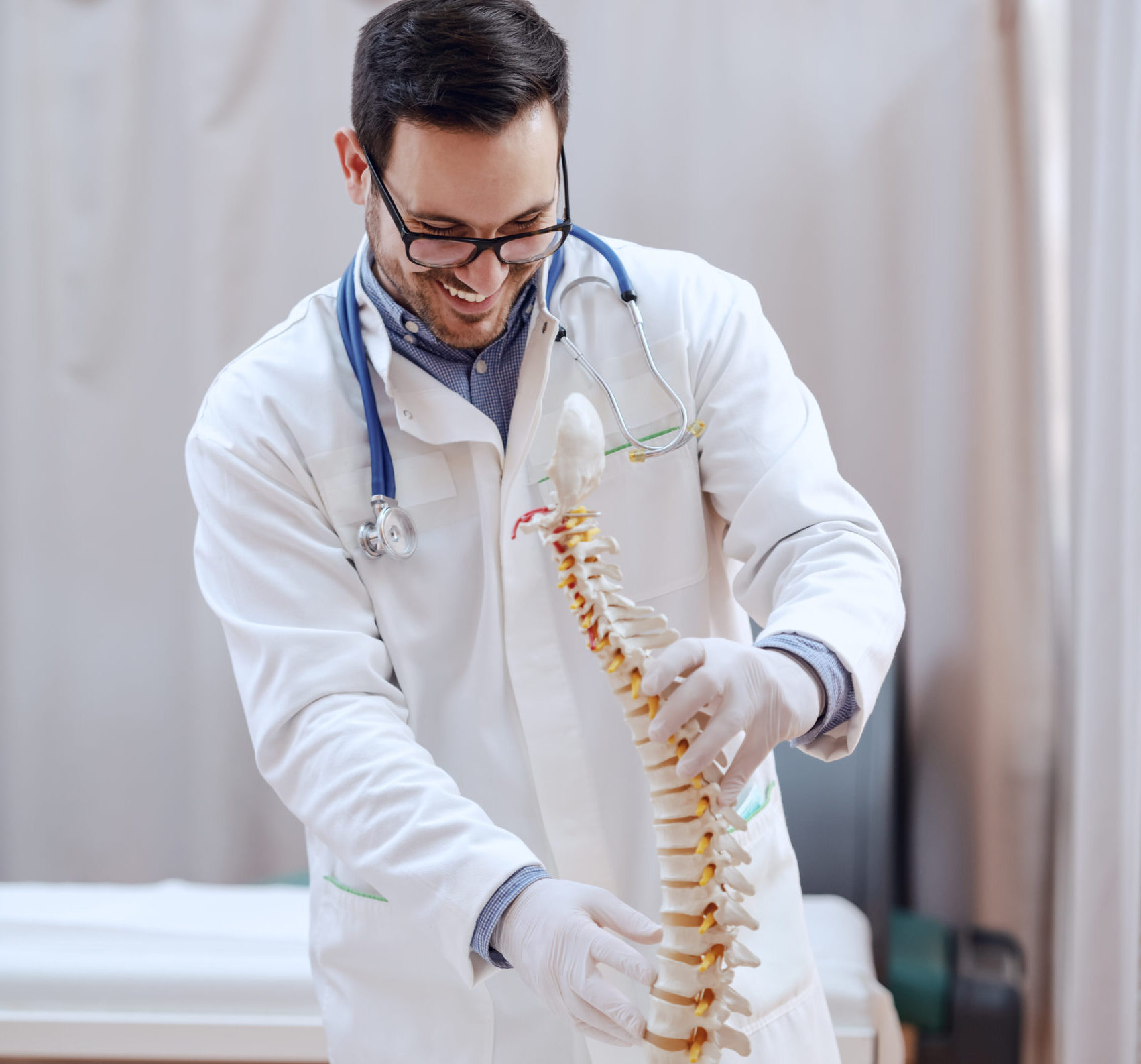 best online consultation for spine surgery in california reviewing patient’s MRI during virtual consultation.