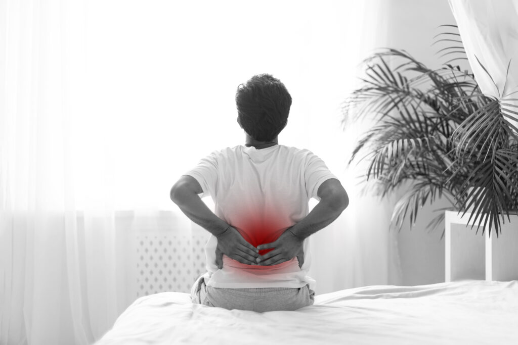 Spine specialist reviewing imaging related to lumbar spinal disorders.