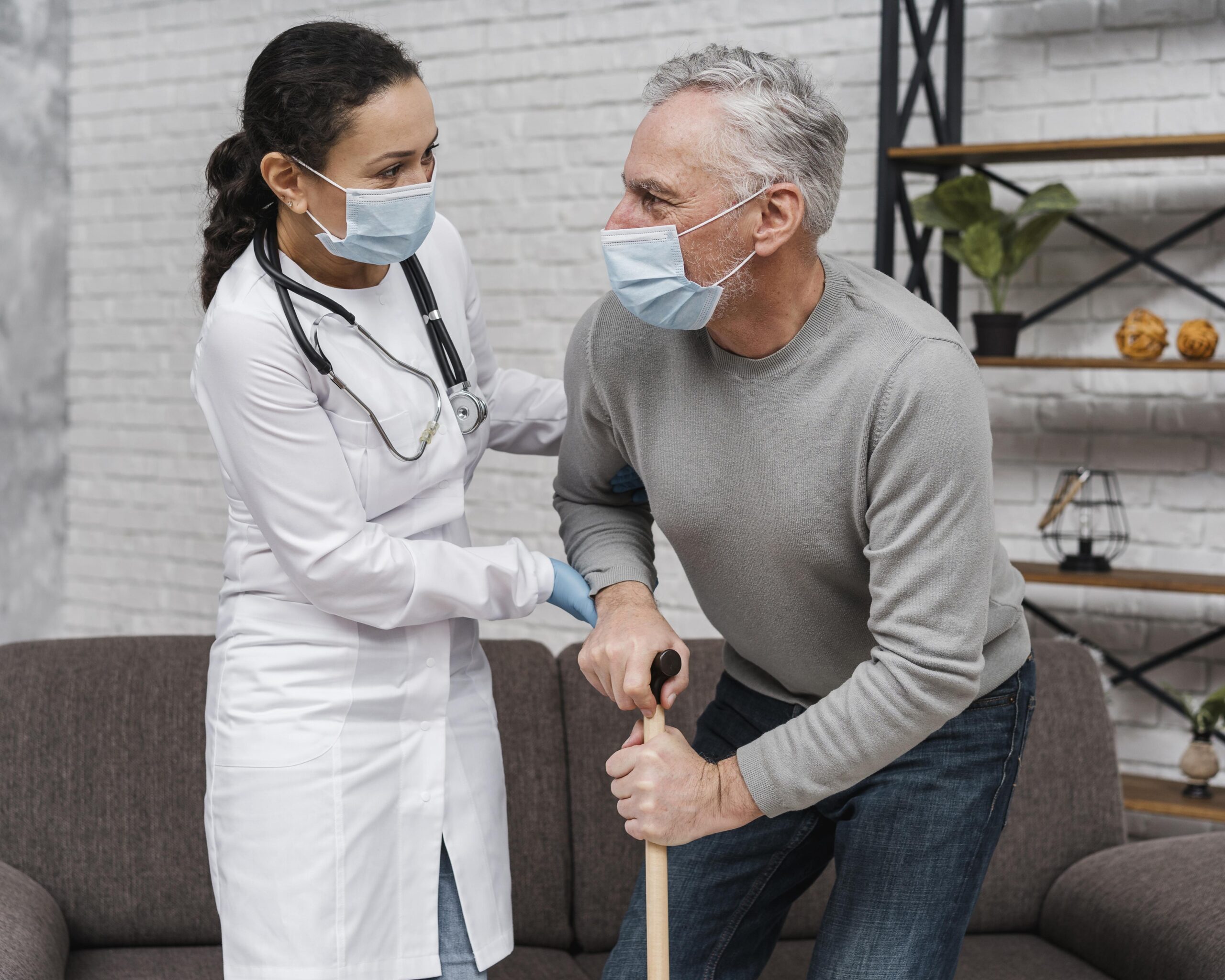 Best spinal stenosis doctor helping elderly patient with back pain and mobility issues from spinal stenosis.